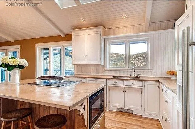Bright kitchen and dining area with skylights