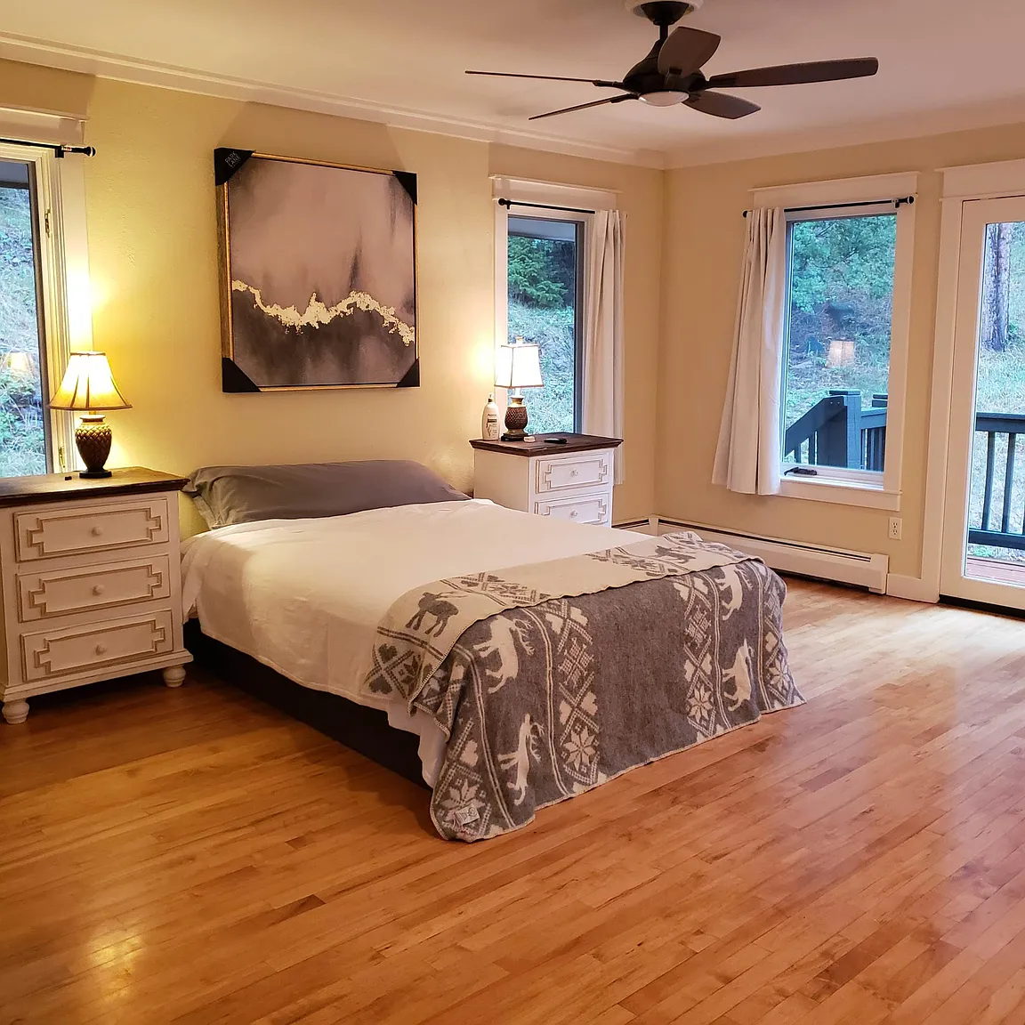 Beautiful master bedroom with exit onto back and side decks
